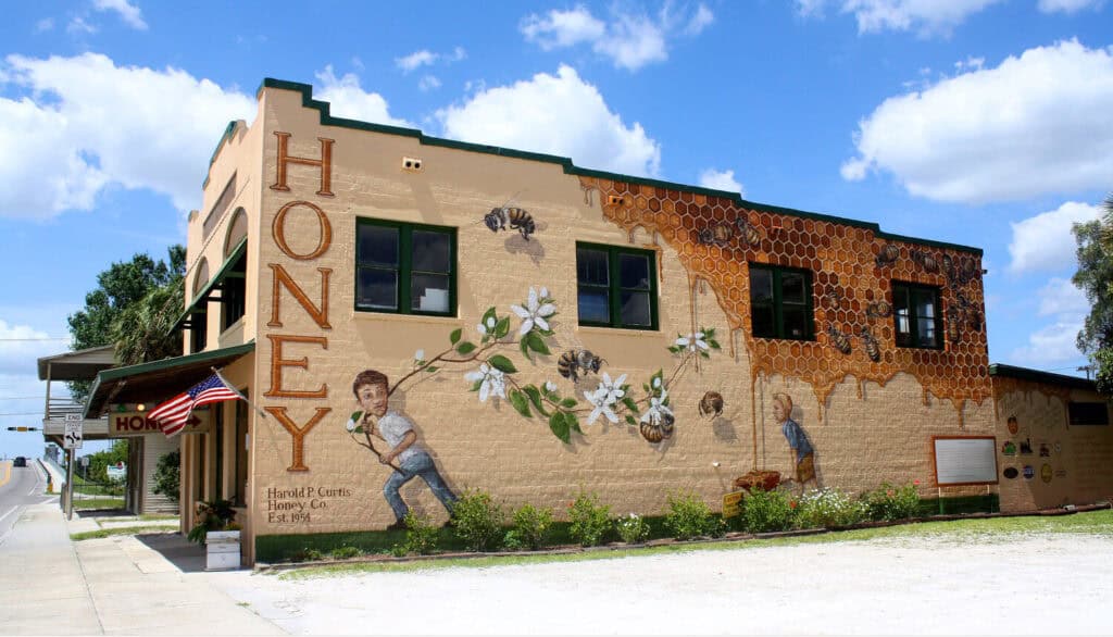 honey and bee mural exterior of building