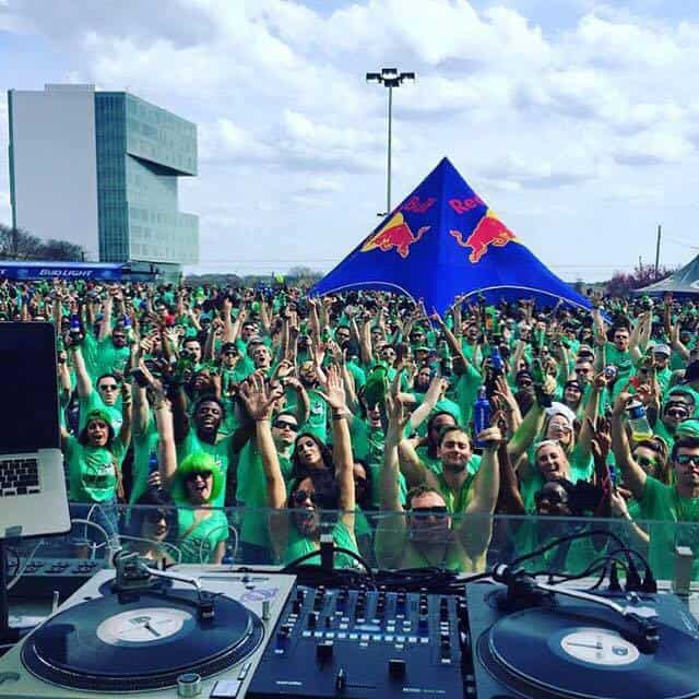 people wearing green at outdoor concert