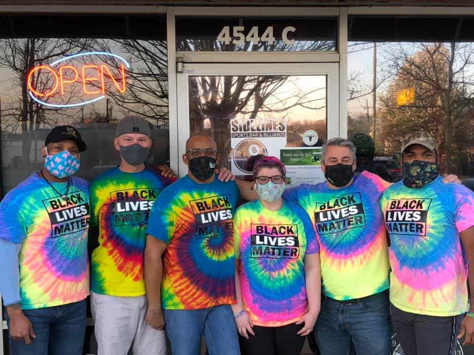 people wearing Black Lives Matter shirts and masks
