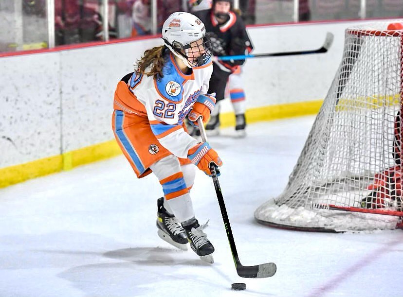 Kristen Simms playing hockey