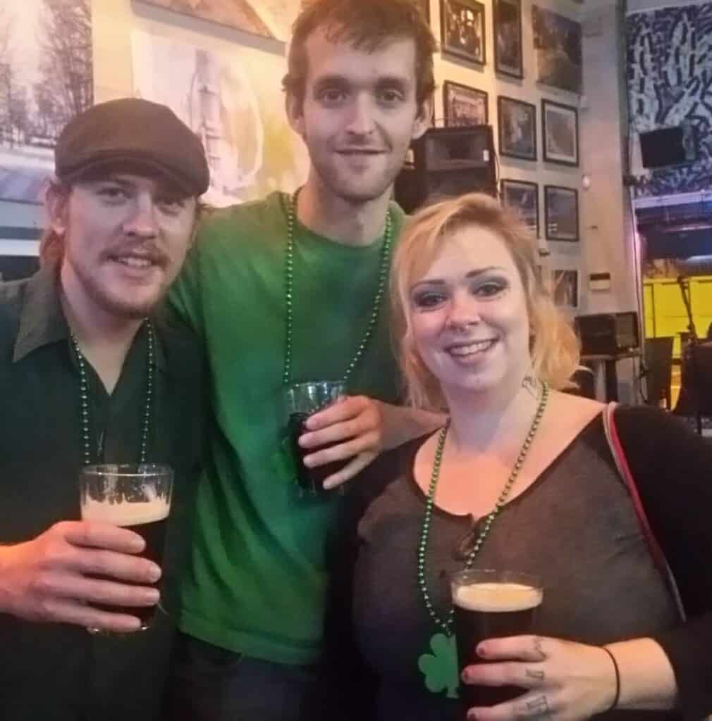 three people in pub on St. Patrick's Day
