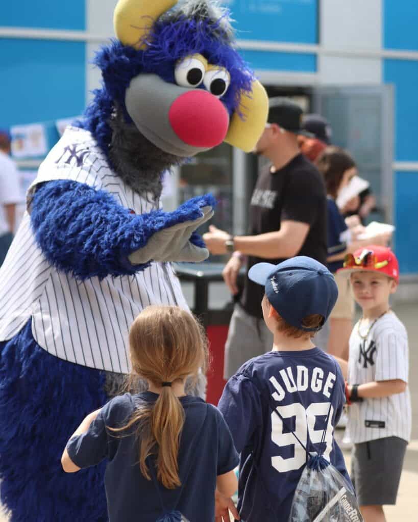 SWB RailRiders mascot high-fiving kids