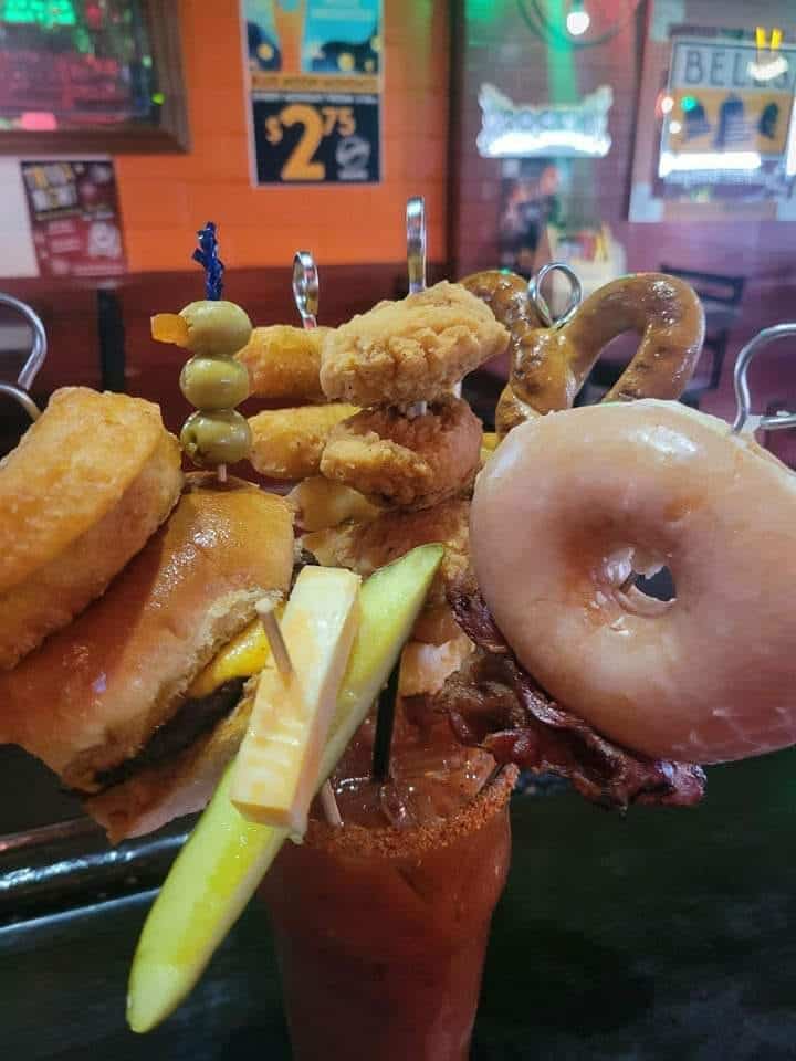 loaded bloody mary with burger and donut