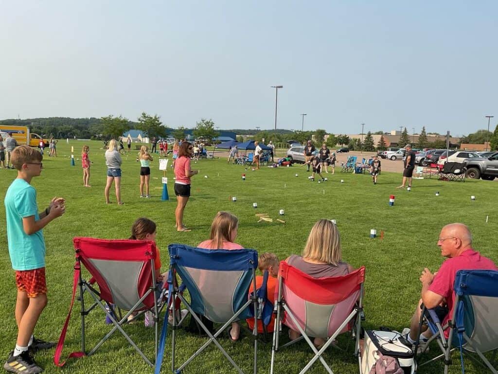 people playing kubb in field