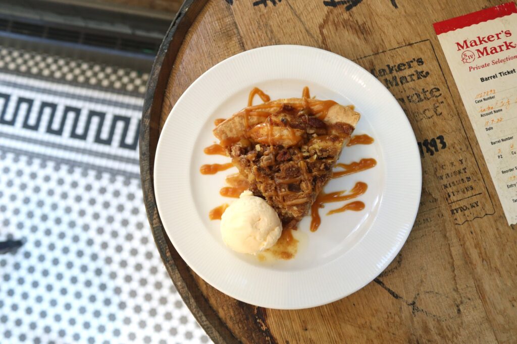 slice of pie with caramel drizzle and ice cream
