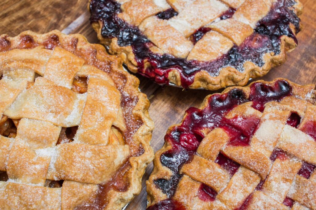 three berry pies with lattices