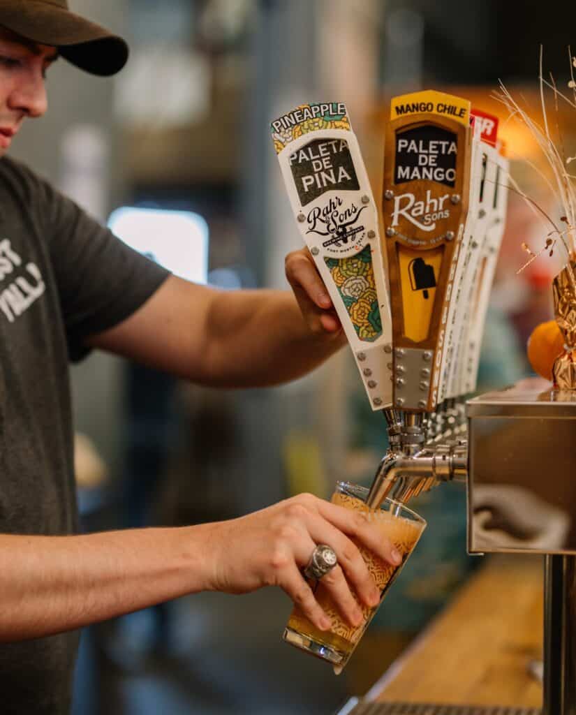 man pouring beer at Rahr & Sons Brewing Co.