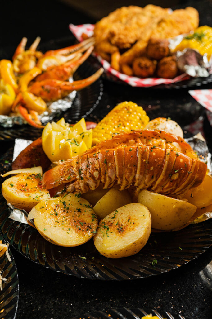 lobster tail on bed of potatoes