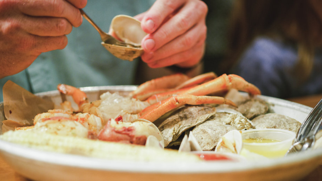 eating oysters and crab legs