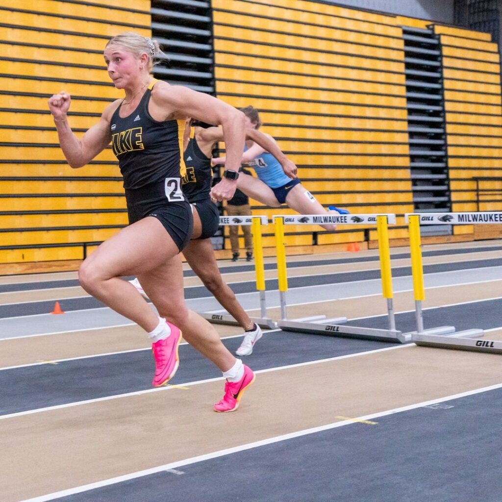 Natalie Block competing in hurdles