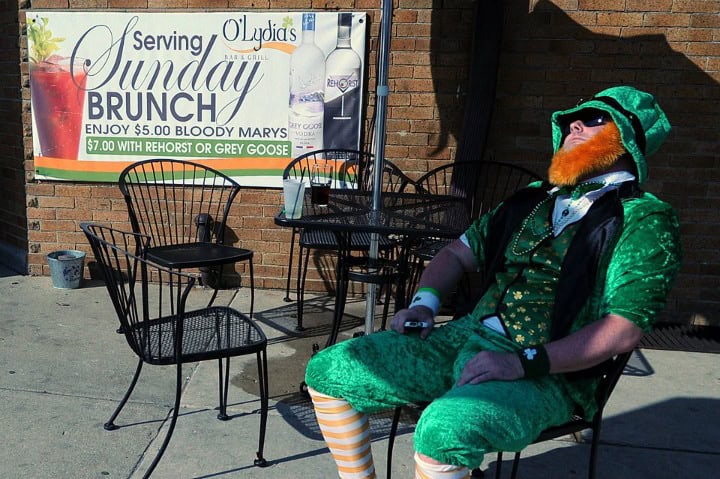 man dressed an Irishman asleep outside