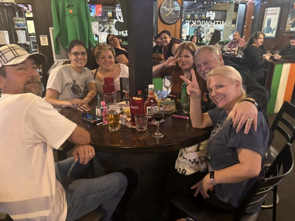 group smiling at pub