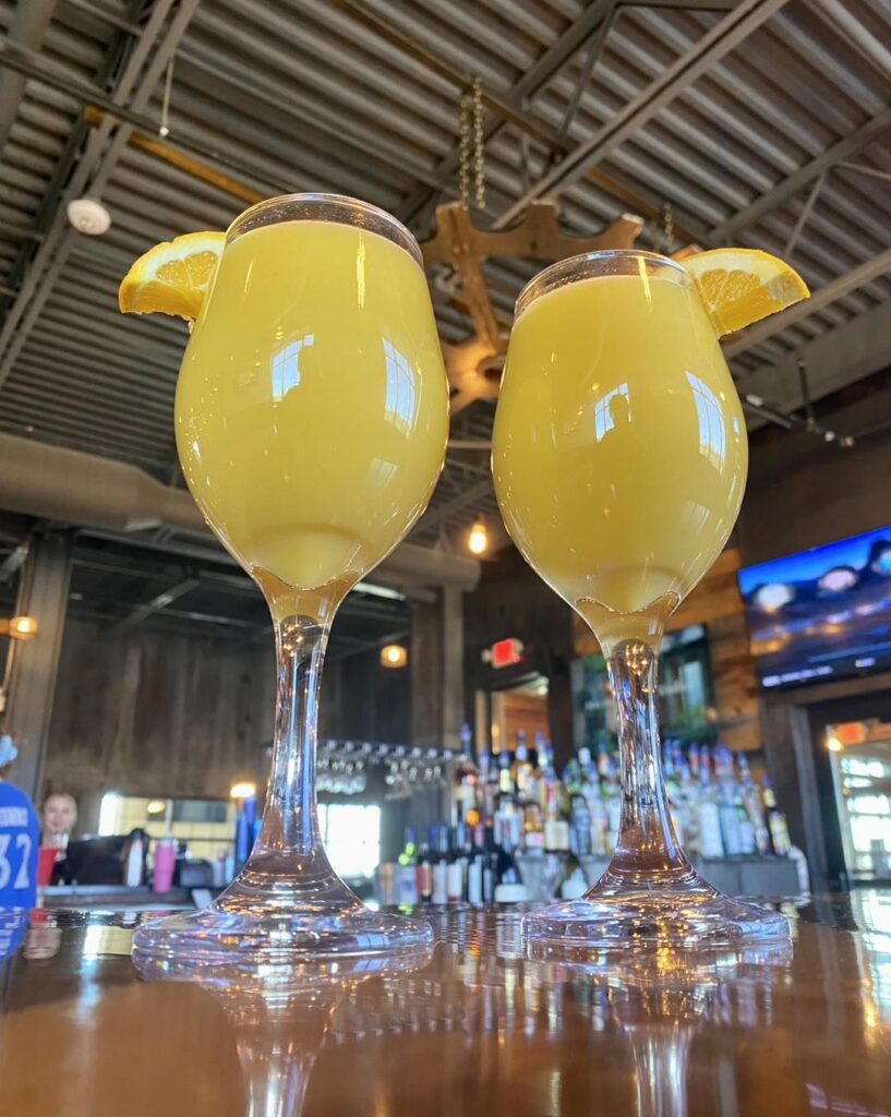 two mimosas with orange slices