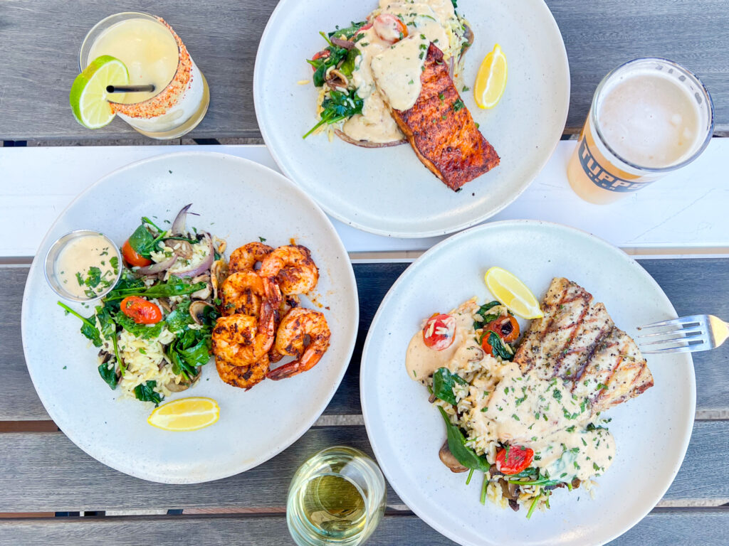 three seafood plates and drinks