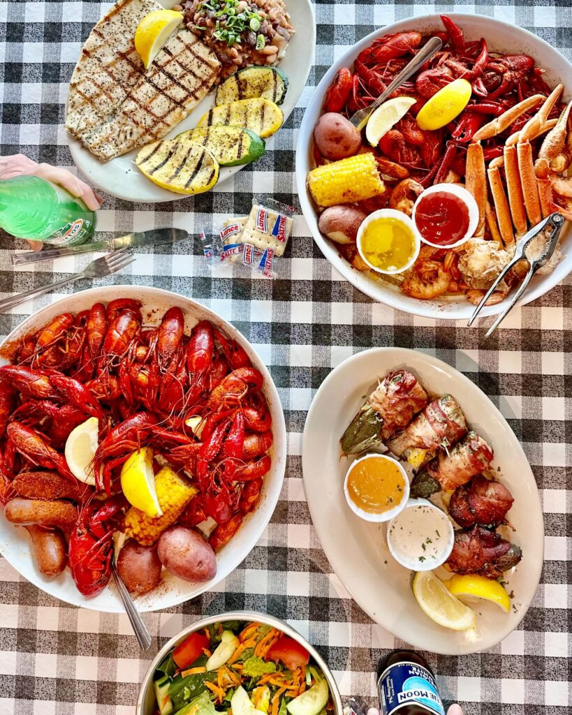 several seafood plates on checkered table