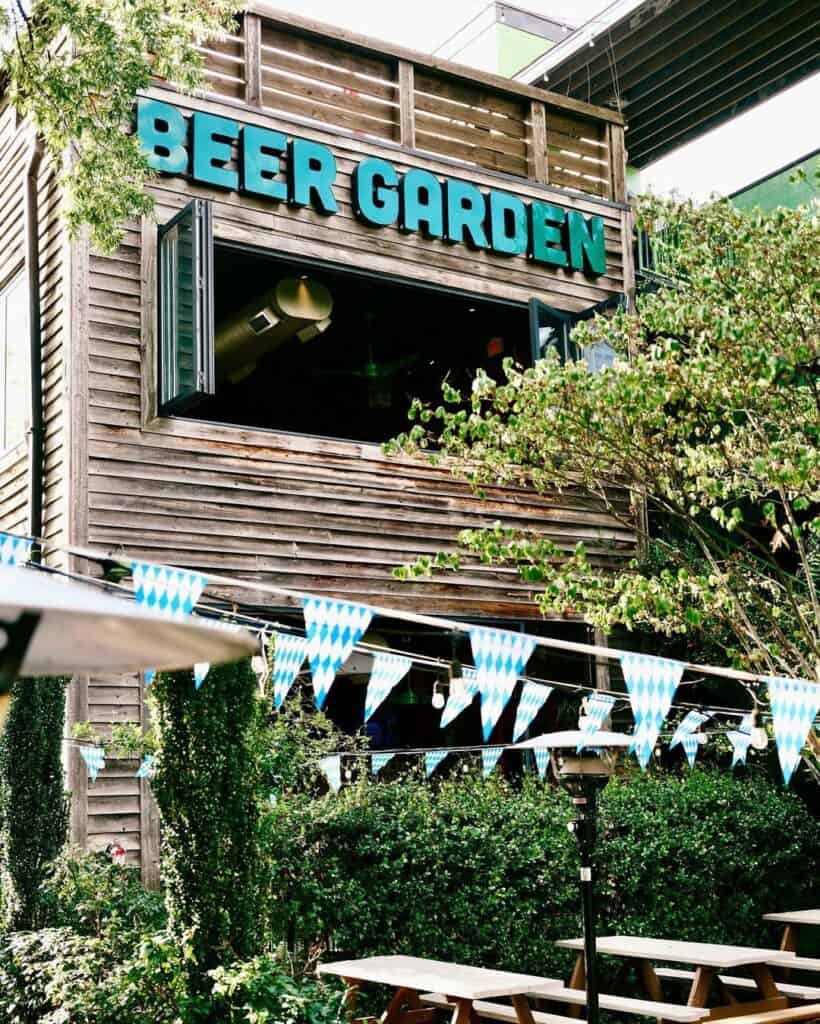 The Raleigh Beer Garden sign and flags