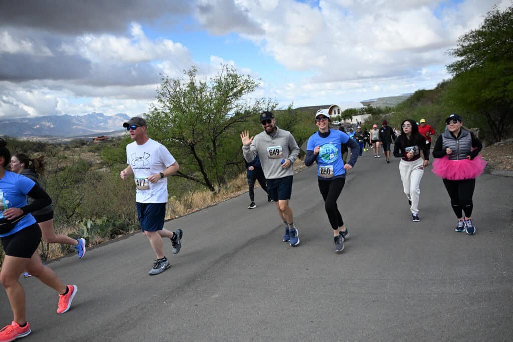Runners participating in the TMC Earth Day K Damion Alexander x